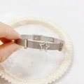 Silver mesh watch-style bracelet with star pendant and crystal block on white tray - 359-4 Silver Tone Bangle (359-4 Silver Tone)