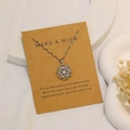 Silberne Blumen-Kreuz-Halskette mit Zirkonia auf einer Make a Wish Geschenkkarte - Hohle strahlende Blume (X-359)