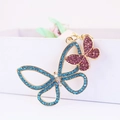 Cute double butterfly keychain with blue and purple crystals on gold metal base - Purple
