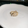 Detailed macro view of 18K gold-plated double leaf ring with sparkling zircon stones - 28# Ring - Gold - Real Gold Plating