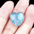 Silver-bordered heart pendant with blue gemstone inlay and circular bail accessory - Blue Tinted Quartz Silver Edging