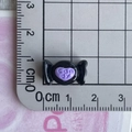 Macro shot showing dimensions of black resin candy charm with purple heart and candy text - 10*Black Purple Candy Sweet Mini