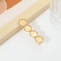 Elegant golden metal hair clip with four circular textured patterns and spring closure - No. 07 Duckbill Clip (Quad Circles)
