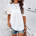 Detail of white cotton eyelet embroidery and ruffle neckline on women's short sleeve top - White