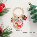 Porte-clés de Noël avec pendentif en verre Père Noël et renne sur décor festif de vacances - Père Noël & Renne