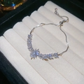 Close-up of silver wheat ear bracelet with shiny zircons and adjustable sliding clasp - Silver