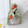 Light green knitted bucket bag featuring white duck patterns and red floral motifs - Green Flower Duck