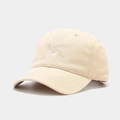 Detail of white smiley face embroidery on a beige cotton twill baseball cap - Smile Embroidery Style / Beige