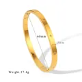 Macro shot of 5mm gold plated stainless steel bangle with star engravings and cubic zirconia - Starburst Engraved Zirconia Style (HF-B5193-G)