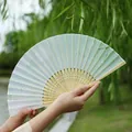 Traditional Chinese folding fan with light teal gradient plum blossom and bamboo ribs - Simple and Elegant