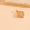 Elegant gold heart pendant with clear cubic zirconia inlay on a minimalist stone - Gold Color Pendant