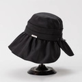 Close-up of black wide-brim sun hat with wavy ruffles and metallic logo detail - M (56-58cm) / Black