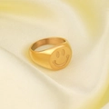 Polished gold smile face signet ring for women on warm silk fabric background - US 5 / Gold 2 (Gold Face Signet)