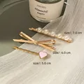 Three-piece Korean hair clip set with white pearls, gold bow, and pink heart charm - Mixed Styles (Set of 3)