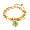 Bracciale a doppio strato in acciaio dorato con perle e ciondolo turchese blu - Oro