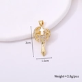 Detail view of a gold cross pendant with clear gemstones showing size 3cm by 1.6cm - Cross Style F