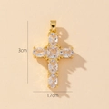 Macro detail of gold-plated cross pendant with oval and square cubic zirconia stones - Style P-Mini Clear Square Zirconia Cross