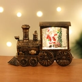 Detailed macro view of vintage bronze Christmas train lantern with glowing Santa interior - Standard Bronze Santa Claus Train (Battery Included)
