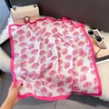 Detail of silk-like satin square scarf with pink shell patterns on white plush background - 70*70cm / Rose Pink Seashell