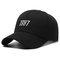 Classic black 1987 embroidery baseball cap with curved brim from 45-degree angle - Black With White Embroidery