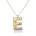 Detail of letter E pendant with hammer texture in gold and silver finish on a chain - Letter E