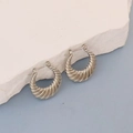 Minimalist silver croissant hoop earrings with ribbed texture on artistic stone - Silver Croissant Spiral Hoop