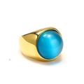 Detail shot of a wide gold plated stainless steel ring featuring a large blue opal gemstone - US 11 / Gold Lake Blue Cat Eye Stone