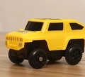 Yellow plastic off-road toy car with black wheels for modular electric track play - Electric Small Car (Universal Model)