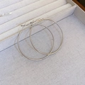 Close-up of minimalist large silver hoop earrings resting on a white jewelry tray - 20# Silver Minimalist Hoop (5cm/925 Sterling Silver Earring Post)