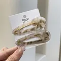 Set de horquillas de acetato mármol crema con base de metal dorado para mujer - Gris tinta