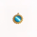 Detailed view of a gold sunflower pendant with a blue cat-eye stone and beaded edge - Round Beaded Edge Inlaid with Blue Cat's Eye (Style 10)
