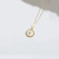 Elegant gold choker necklace with a round mother of pearl pendant featuring a crescent moon - Moon