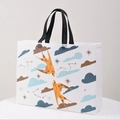 White non-woven gift bag with orange bird pattern and black woven handles - Horizontal 27*32*10cm / Dual Swallows