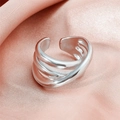 Minimalist silver multi-layer coiled spring ring on a soft pink satin background - JZ647 Multi-layer Streamline / Silver