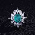 Close-up of vintage flower ring with oval green emerald and white zircon accents - Adjustable Open / Style B-Emerald Oval Flower Cluster