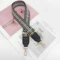 Detail of adjustable ethnic style embroidered wide strap with gold-tone swivel lobster clasps - Black Base Apricot with Black Leather