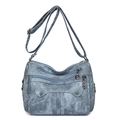 Vintage blue washed faux leather crossbody bag with multiple zippers and studs - Blue