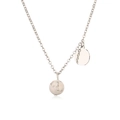 Macro shot of silver stainless steel necklace with marble bead and round metal disc charms - Steel White Turquoise