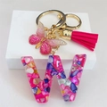 Detail of resin letter W keychain with pink butterfly, rose red tassel and gold clasp - Rose Red Butterfly Tassel Clip / Letter W