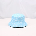 Detailed view of the sky blue bucket hat featuring white skull and BOO prints - One Size / Lake Blue