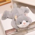 Soft lying grey and white cat plush toy with pink nose and fluffy fur texture - Cat