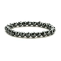 Macro detail of elastic beaded bracelet with faceted black volcanic natural stone beads - Faceted Hematite