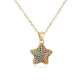 Macro shot of 18K gold star pendant with multi-colored zircons on white background - Colorful Zirconia