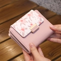 Short pink leather floral wallet with gold metal buckle and embossed floral pattern - New Pink