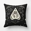Detail of Halloween black cushion cover with white occult mystical eye and snake patterns - Occult Element Symbols