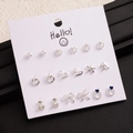 Detail view of 9 pairs silver cherry and heart earring set on a white display card - Silver Pearl Hollow Heart Cherry Earrings (E0239-1)