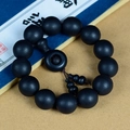 Macro detail of matte ebony wood prayer beads with Ping'an buckle on vintage book background - 18mm Round Beads * 13Pcs With Gourd Pendant