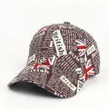 Detail of vintage Union Jack graffiti baseball cap with newspaper print texture - Adjustable / Coffee