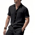 Détail d'une chemise en lin noir avec boutons ambrés et une poche sur la poitrine - S / Noir