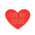 Red heart-shaped enamel pin with golden metal border and Cute But Psycho text design - CUTE BUT PSYCHO Heart/Red